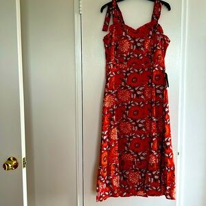 100% cotton tank maxi dress with rushed neckline and smocked back.  Size L